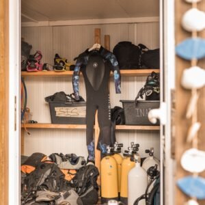 Neatly organized scuba diving equipment in storage