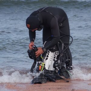 Scuba diving instructor demonstrating a skill underwater