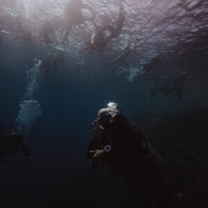 Divers exploring the deep blue ocean