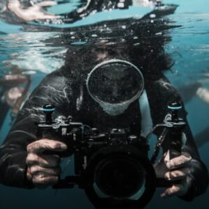 Diver holding a professional underwater camera