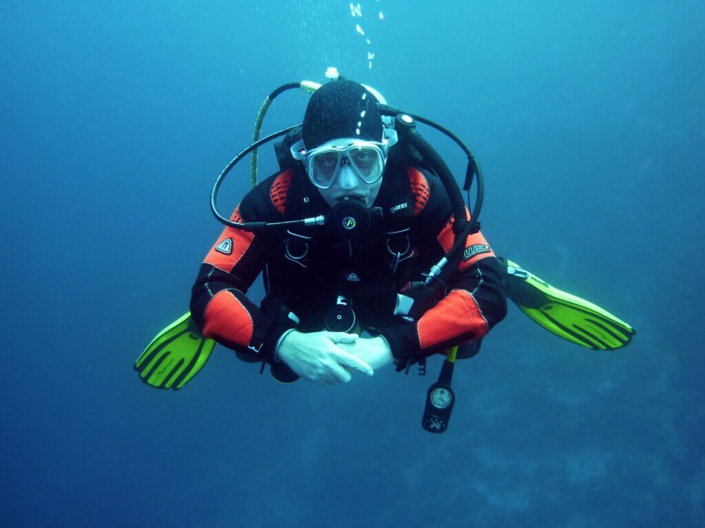 Scuba diver underwater in clear blue ocean