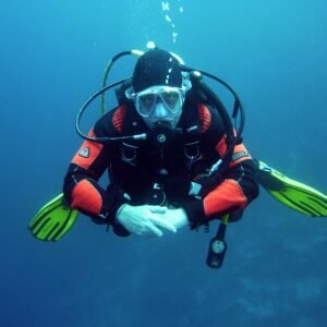 Scuba diver underwater in clear blue ocean