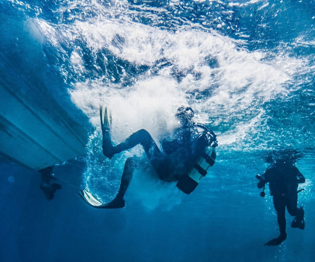 Scuba diver swimming through clear ocean water