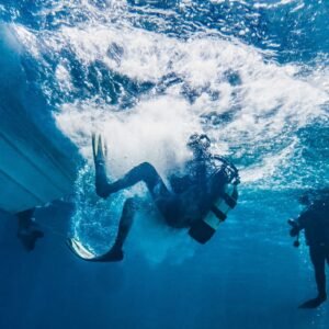 Scuba diver swimming through clear ocean water